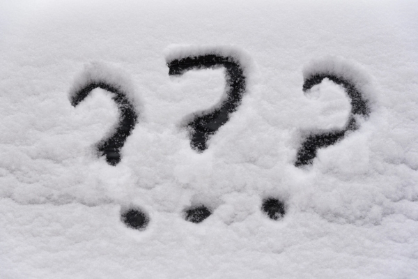 3 question marks drawn on snow depicting FAQs about uneven heating in house