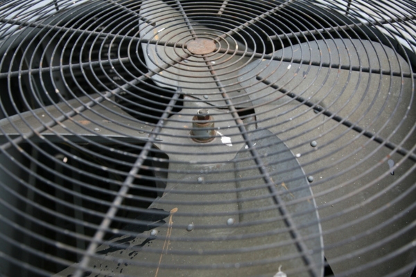 image of air conditioner damaged fan blades that makes pulsating noise