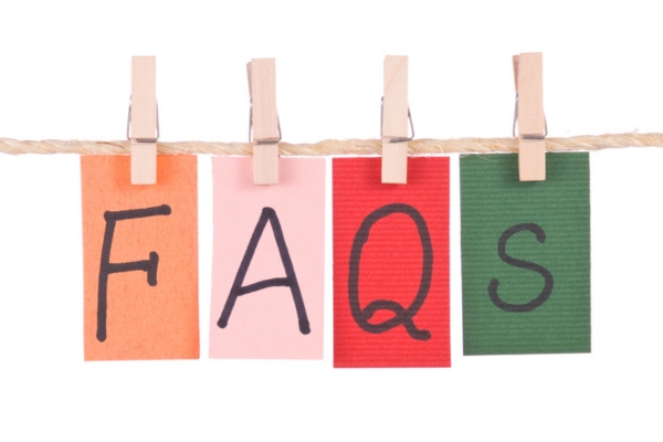 FAQs written on different colored papers hanging using wooden mini clips and natural rope