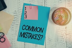 common mistakes written on a colored paper with 123 written on a sticky note on top
