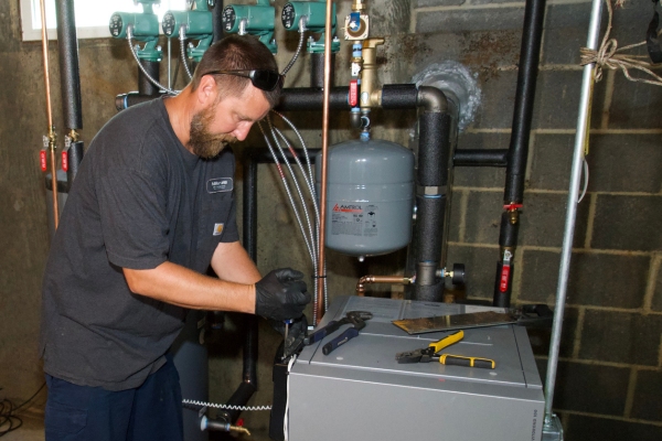 Miller Oil Company HVAC technician servicing a residential client