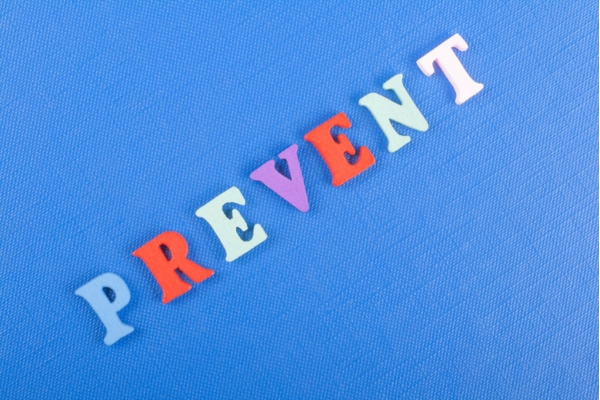 prevent word using letter magnets on blue background depicting ways to avoid frozen heating oil