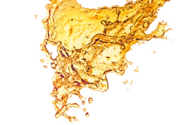 a splash of gold liquid depicting heating oil composition