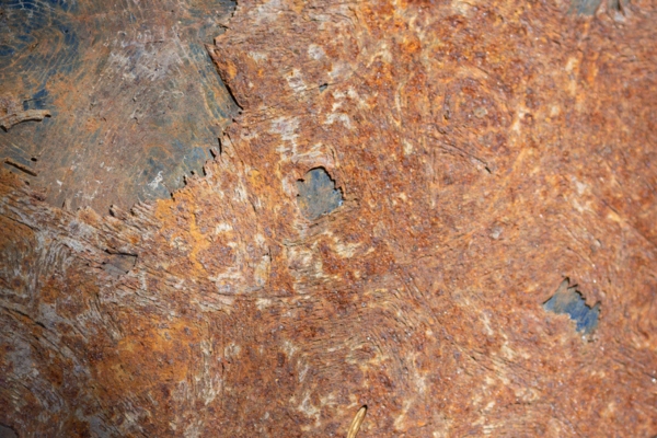 rusty metal sheet depicting corrosion in heat exchanger