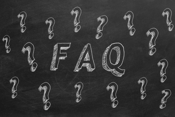 FAQ and question marks on chalkboard depicting common questions about Will Call vs Automatic Oil Delivery